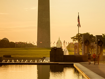 Group of people running beside Reflecting Pool on National Mall