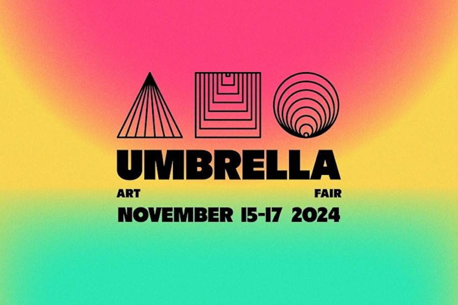 A colorful promotional graphic featuring the title "Umbrella Art Fair" in bold letters, along with geometric shapes and patterns, set against a gradient background of vibrant pink, yellow, and green. The event is scheduled for November 15-17, 2024.