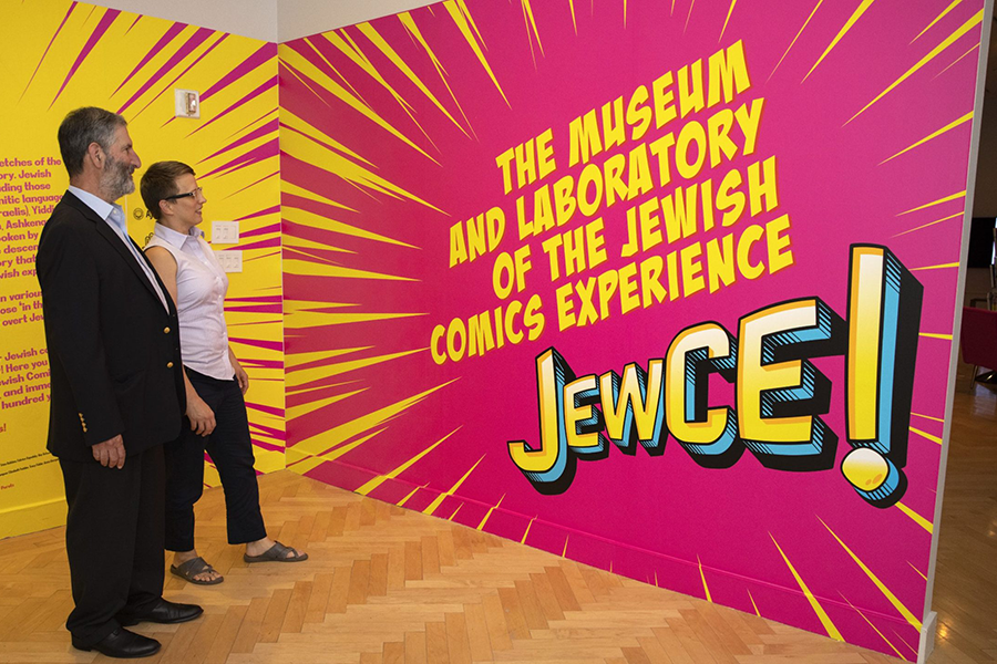 Two people at the JewCE exhibit 