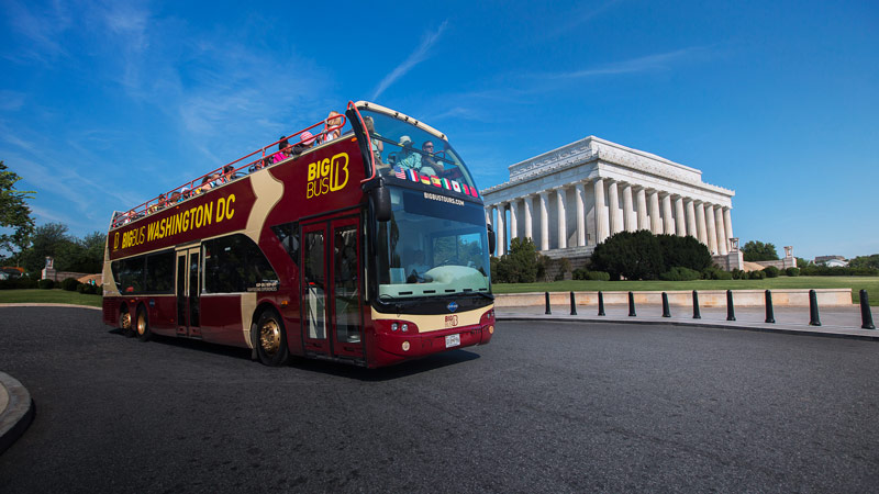 Big Bus tour in front of Lincoln Memorial - Eco-friendly group tour options in Washington, DC