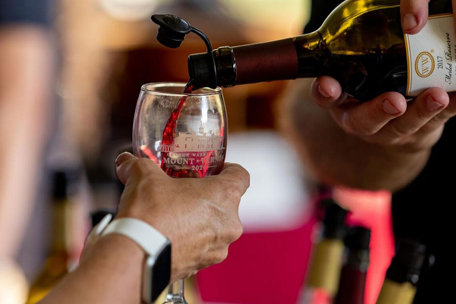 Wine pouring into glass at Mount Vernon Fall Wine Festival